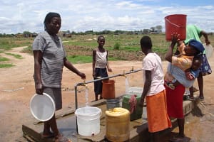 What motivates people to fetch water at the safe well?